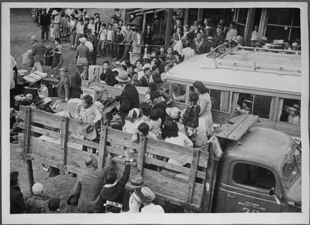 Group of Japanese Canadians being transported to camp at Slocan, British Columbia, 1942 (Credit: Tak Toyota, Library and Archives Canada, C-046350)
